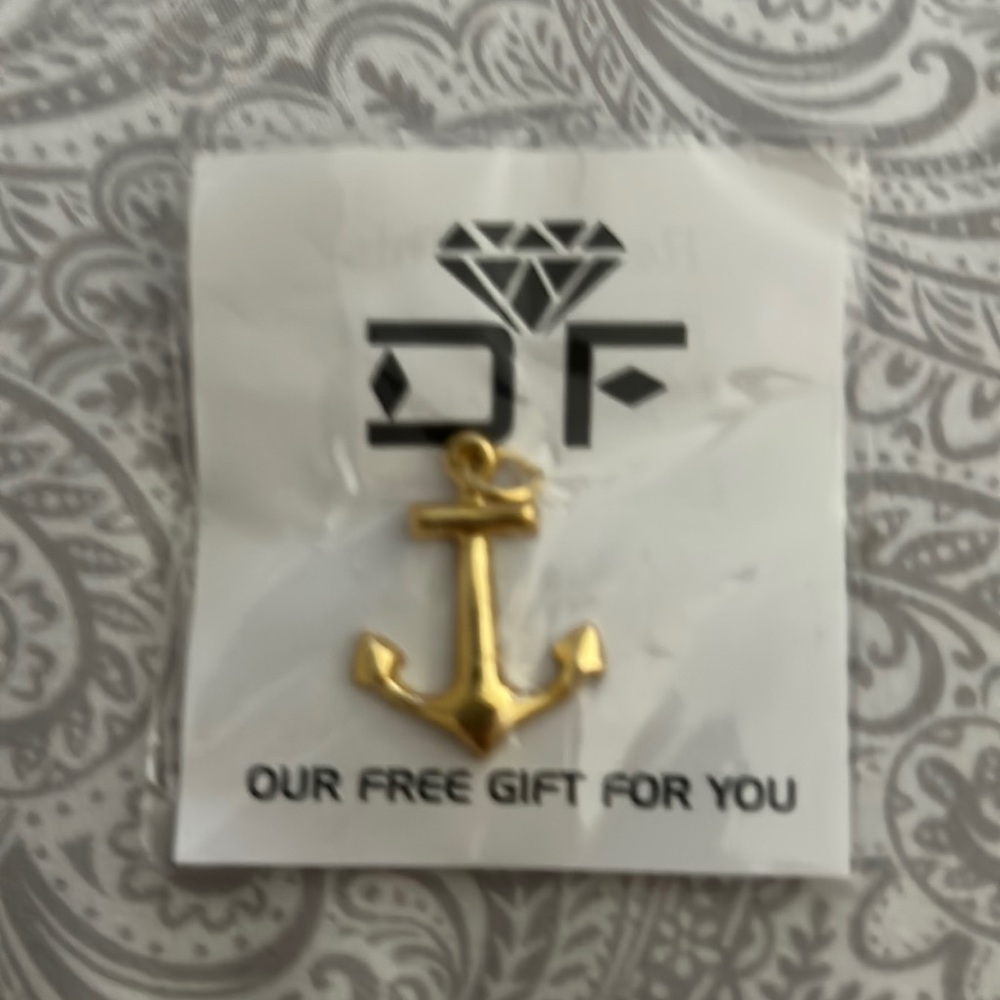 Gold tone anchor